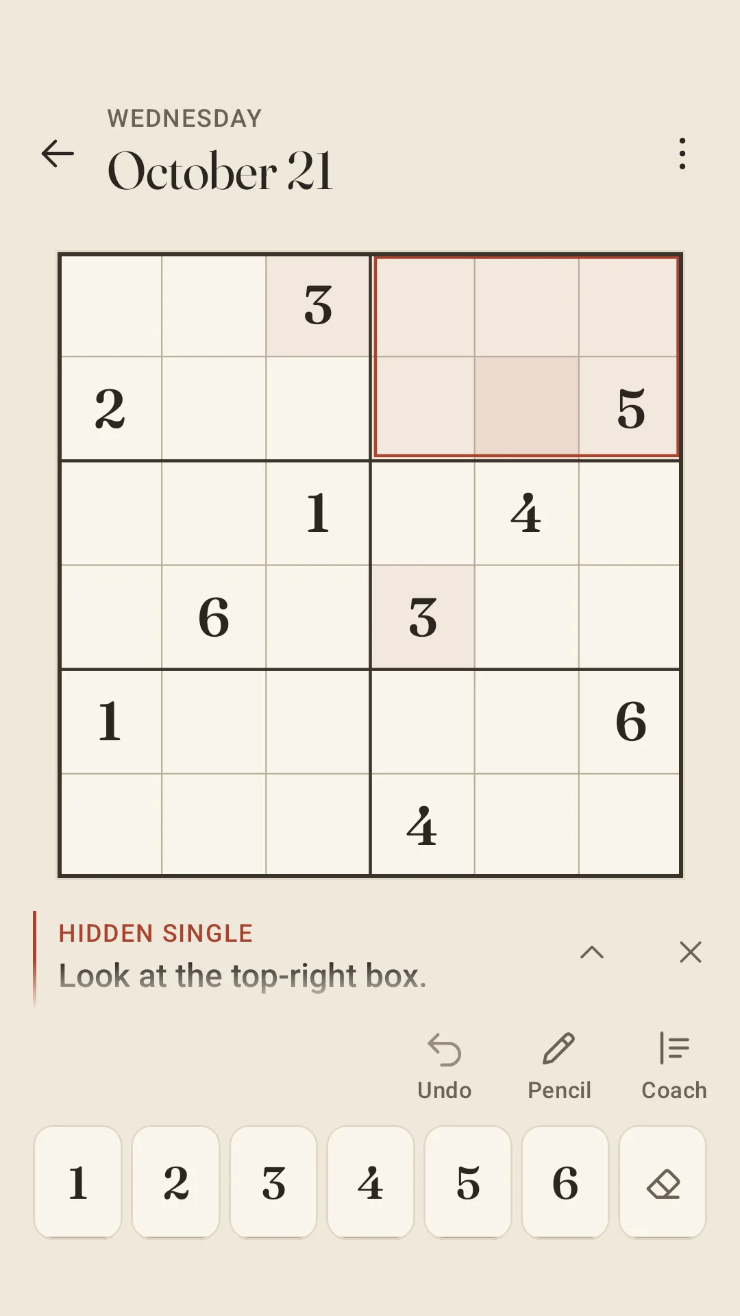 A 6×6 daily page for Wednesday, October 21: the Coach has outlined the top-right box in terracotta, and its note above the tools reads “Hidden single. Look at the top-right box.”